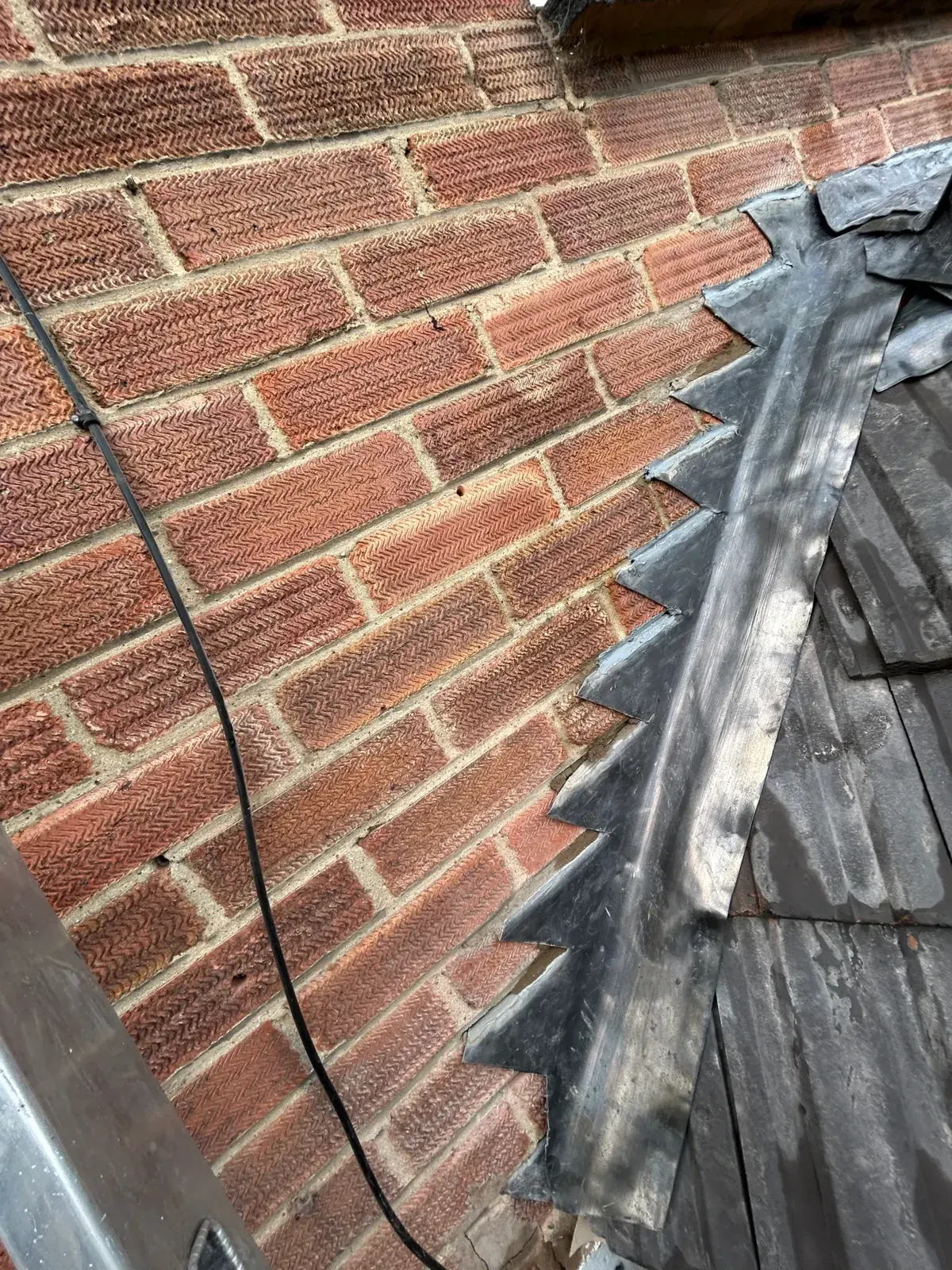 Lead step flashing brickwork