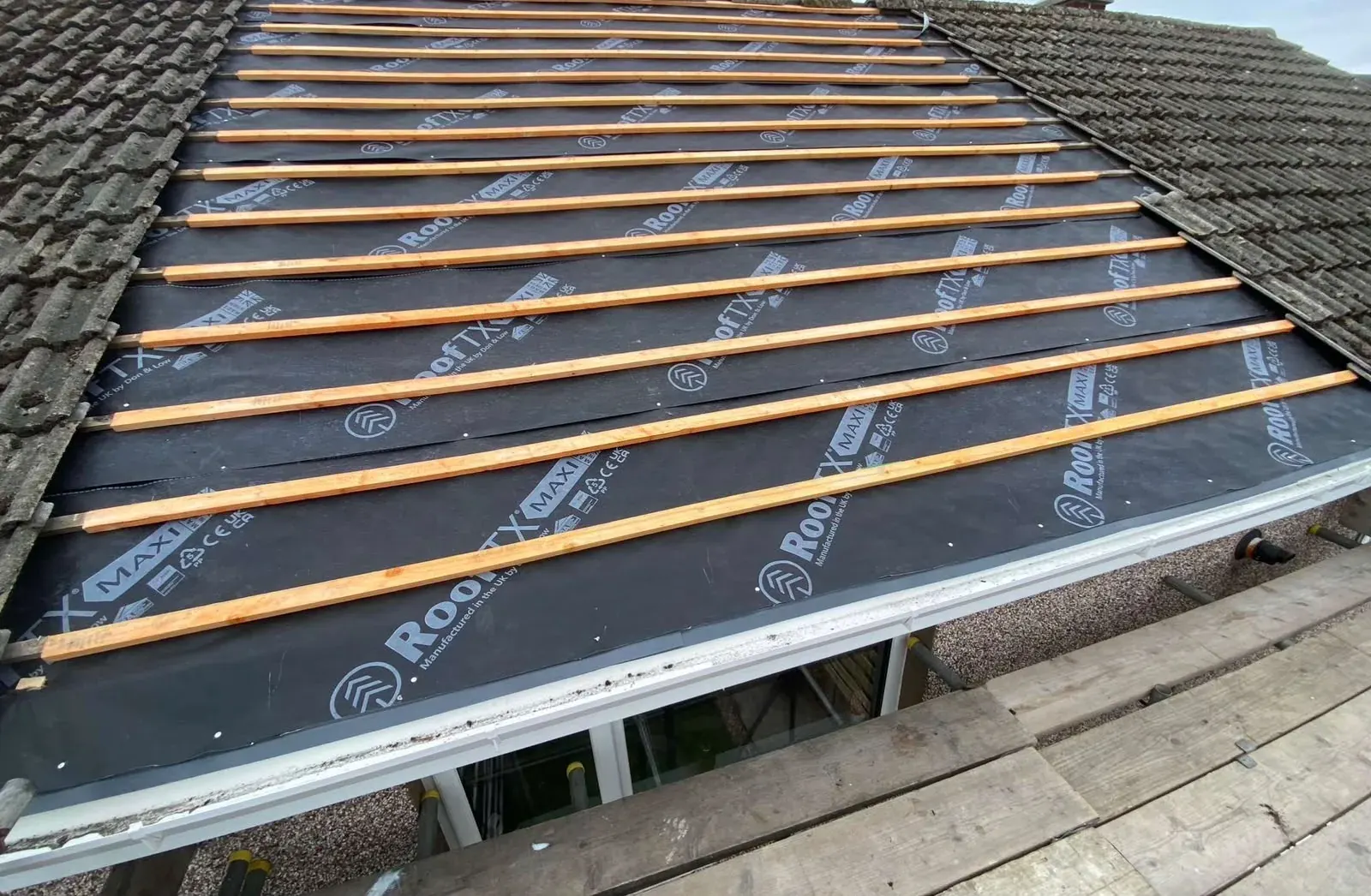 Stripped roof with breathable membrane and new battens by DJW Roofing & Leadwork